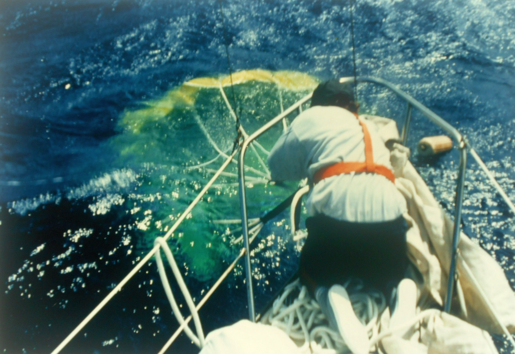 Snubbing the parachute so that it fills. At this stage it is then gradually paid out as the boat drifts downwind from the inflated canopy.